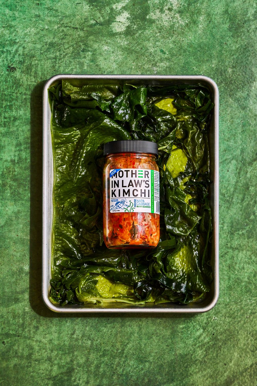 House Reserve Seaweed Kimchi jar resting in a tray of seaweed